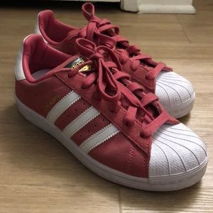 Pink and white shell toe superstars